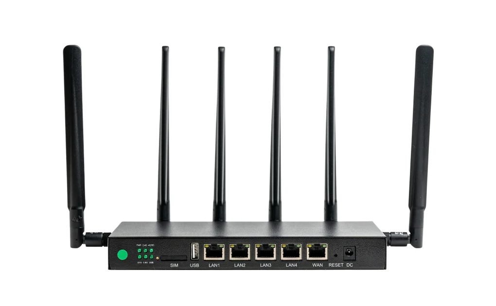The Cat 20 (MR40) 5G router: a black metal unit with six external antennas and a row of network ports.